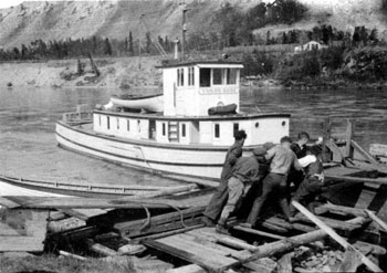 “A few snaps of the Yukon Rose on her first trip up the Pelly - July 1929 Loading up.”

