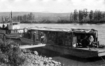 “A few snaps of the Yukon Rose on her first trip up the Pelly - July 1929  At Ross River. Pulling out.”
