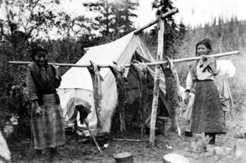 These girls are carrying 120 lbs. of salmon, ca. 1929.