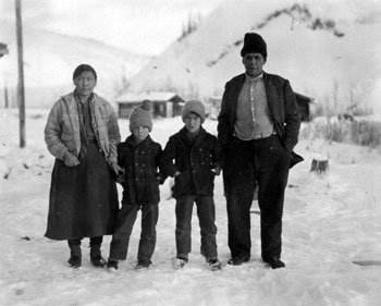 “Our dog-mushing mail-carrier [William Atkinson] with wife & family. Xmas, 1930.”