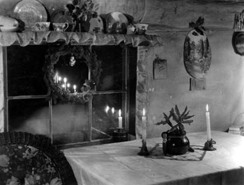 “Burning candles for the ‘Home Folks’.” Mary carried on this tradition in all their Yukon home, including their Twelve Mile cabin. ca. 1938