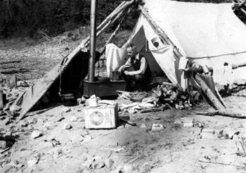 This bittersweet photo was one of the last Claude was to take in the Yukon: “This is the Life! My last camping in the Yukon – along the Porcupine River, July 1946.”