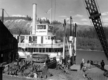 “The Klondike pulls up to the dock in Whitehorse for loading”, ca. 1943.