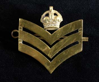 Claude's sergeant pin.