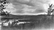 “In and around Forty Mile, Spring 1932.” Claude took this panorama shot from across the Forty Mile River.