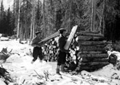 “Getting next winter′s wood March 1938 Forty Mile. Piling the wood.” 