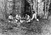 Mary, Honey, an unidentified man, and Arthur Anderson enjoy a picnic near Forty Mile, May 1932.