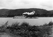 Claude inscribed this photograph: “Taken on a dull day – so the picture lacks brightness and sparkle – but it is one of the good old S.S. Yukon chugging up-stream. It was taken from the river bank directly in front of our house. There will only be about one more trip for her this season – so maybe it will be our last chance to photograph her – ever.” August 1938.