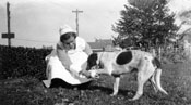 “First Aid.” This photo of Mary with the family dog, Bill, reflects the love for animals she displayed throughout her life.